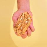 Biscoff New York Cookie split open showing white chocolate chips and oozy Biscoff Lotus spread filling from Crumbs & Doilies.